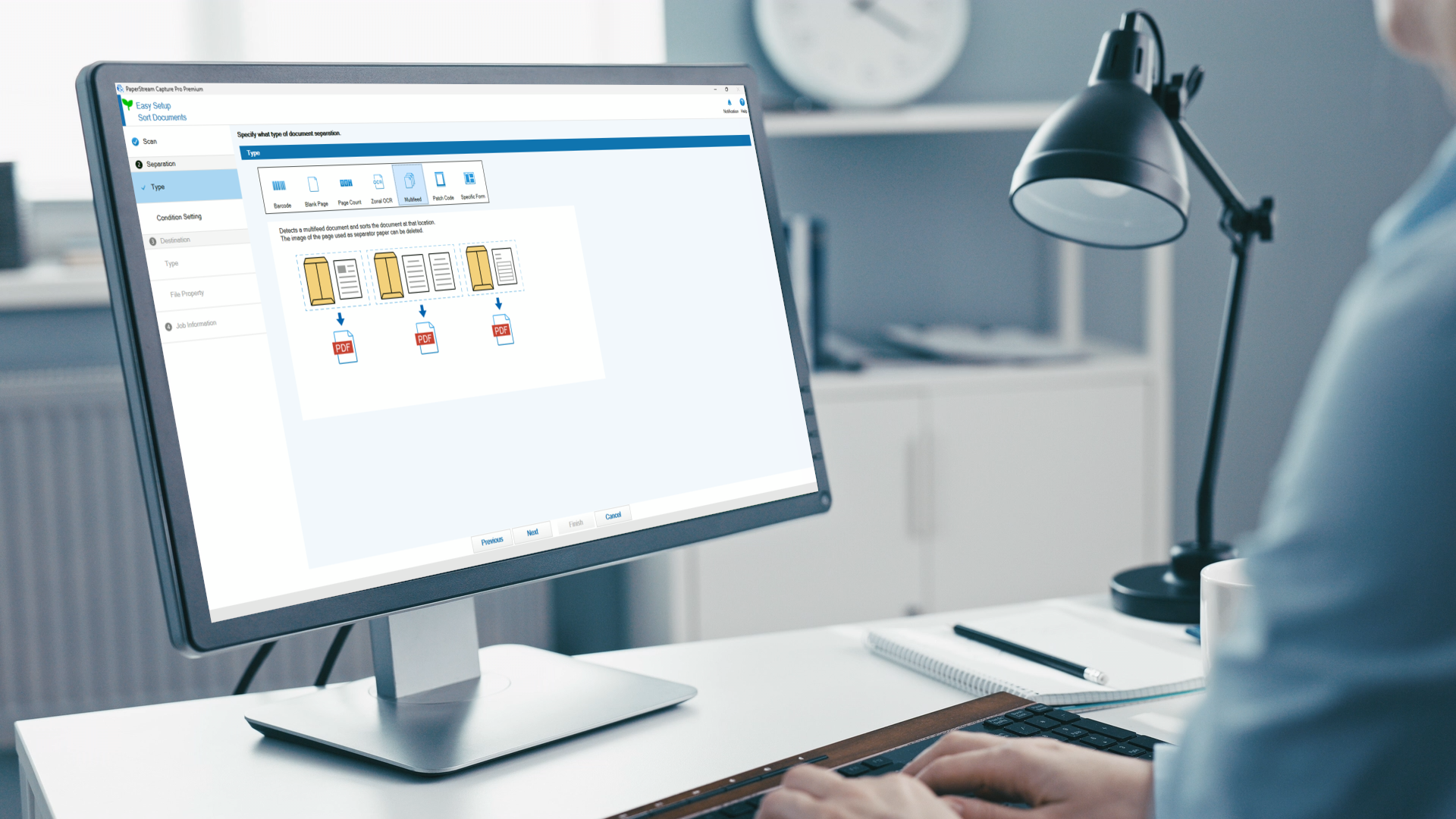 A person using PaperStream software on a computer