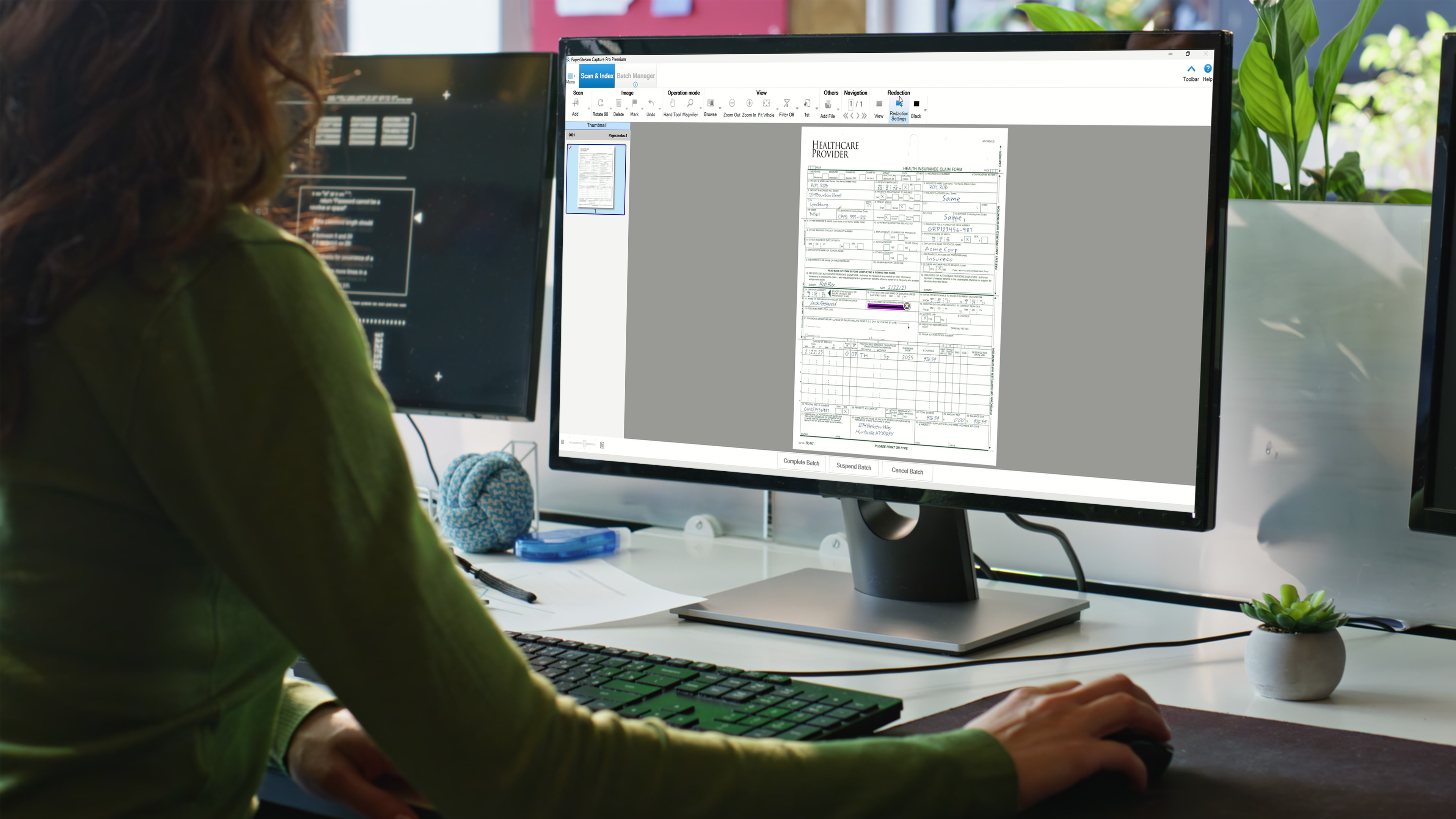 A woman using PaperStream on a computer